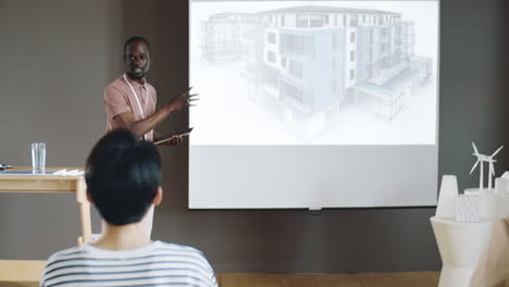 African-American-Man-Presenting-Architectural-Project-on-Conference